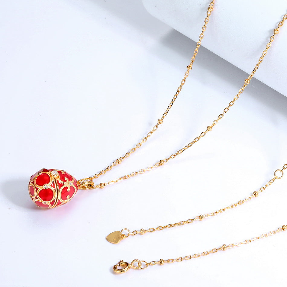 S925 Sterling Silver Plated 9K Gold Dripping Pattern White Zirconium Egg Necklace