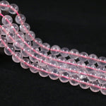 Round rose quartz with a straight hole