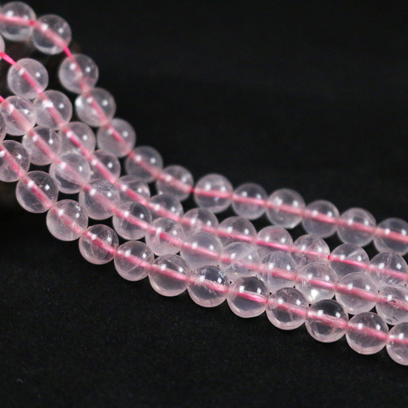 Round rose quartz with a straight hole
