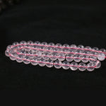 Round rose quartz with a straight hole