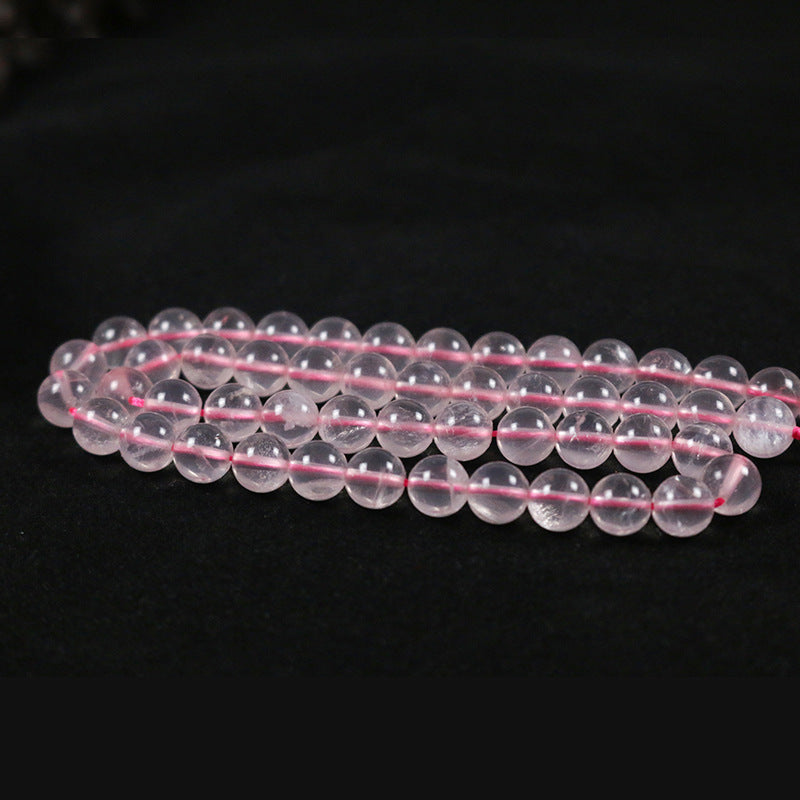 Round rose quartz with a straight hole
