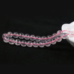 Round rose quartz with a straight hole