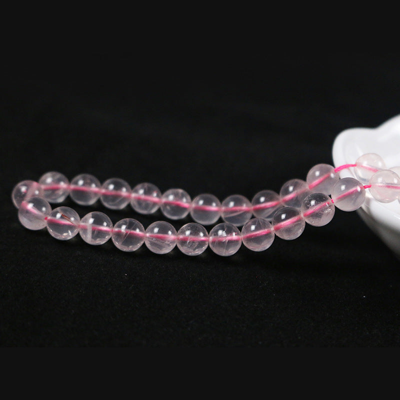 Round rose quartz with a straight hole
