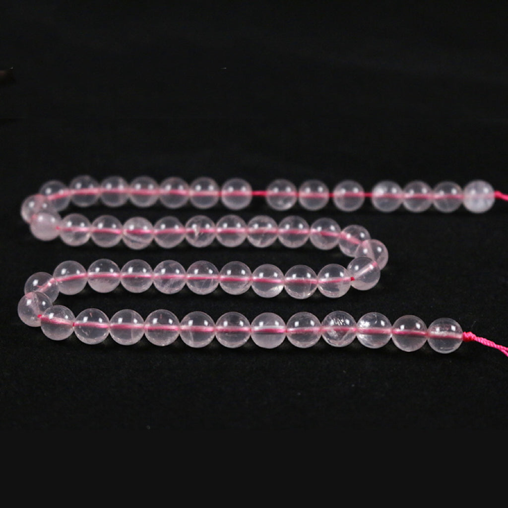 Round rose quartz with a straight hole