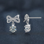 Stylish and elegant moissanite earrings with a bow design in 925 sterling silver