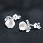 925 silver "balance beam" earrings, set with freshwater pearls and moissanite.