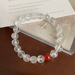 Cut white crystal beaded red agate bracelet