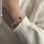 Cut white crystal beaded red agate bracelet