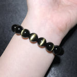 Natural Golden Obsidian Bracelet with Cat's Eye Effect and "Single-Line" Pattern