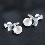 925 silver "balance beam" earrings, set with freshwater pearls and moissanite.