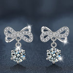 Stylish and elegant moissanite earrings with a bow design in 925 sterling silver